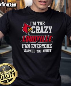 Official I'M The Crazy Louisville Fan Everyone Warned You About T-Shirt design featuring bold text and vibrant colors.