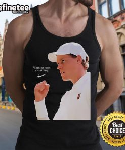 Alt Text: Jannik Sinner wearing the Nike x Wimbledon 2025 'Winning Heals Everything' tank top on grass court.