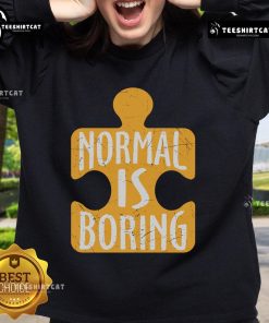 Official Normal Is Boring Puzzle Piece Autism Awareness Sweatshirt in vibrant colors promoting autism acceptance.