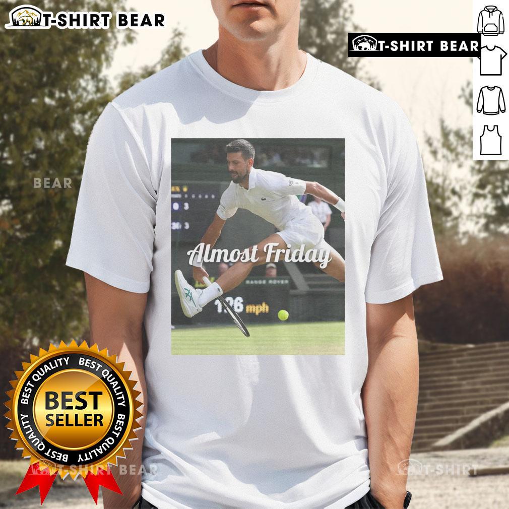 Official Novak Djokovic Between The Legs Almost Friday T Shirt Official Novak Djokovic Between The Legs Almost Friday T-Shirt featuring a playful design for tennis fans.