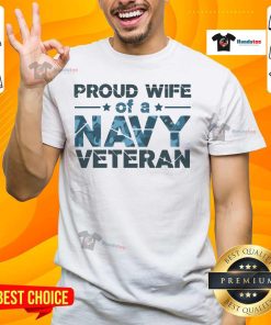 Alt Text: Official Proud Wife Of A Navy Veteran Navy Camo Text T-Shirt featuring bold camo design and patriotic lettering.