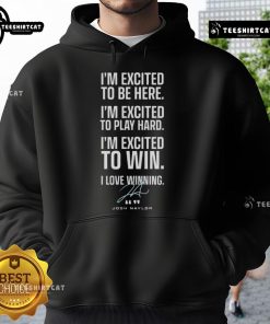 Alt Text: Josh Naylor wearing an official Seattle Mariners hoodie with 'Excited To Be Here, Play Hard To Win' signature.