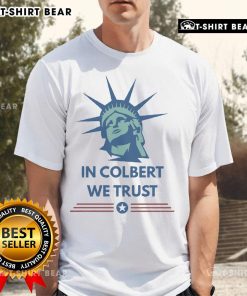Official Stephen Colbert In Colbert We Trust T-Shirt featuring bold text design, ideal for fans of the late-night host.