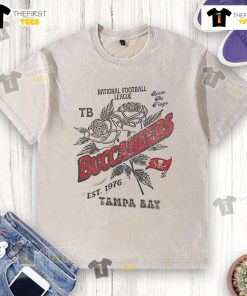 Alt Text: Official Tampa Bay Buccaneers rose washed t-shirt, celebrating the NFL team established in 1976. Perfect for fans!