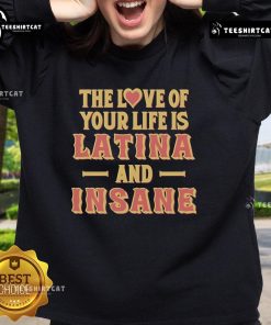 Official 'The Love Of Your Life Is Latina And Insane' Sweatshirt featuring vibrant design and cozy fit for casual wear.
