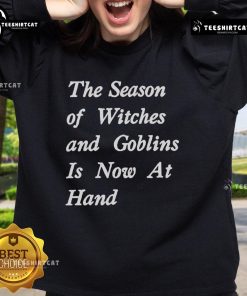 Alt Text: Cozy sweatshirt featuring The Season of Witches and Goblins design, perfect for celebrating Halloween festivities.