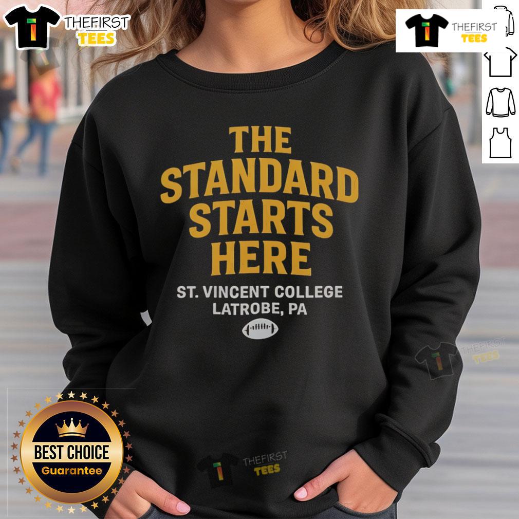 Official The Standard Starts Here St Vincent College Latrobe Pa Sweatshirt Official St. Vincent College Latrobe PA sweatshirt showcasing 'The Standard Starts Here' design in vibrant colors.