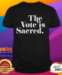 Alt Text: Official The Vote Is Sacred T-Shirt featuring a bold design promoting voter participation and civic engagement.