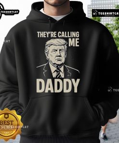 Alt Text: Official Trump 'Theyre Calling Me Daddy' hoodie featuring bold text and a stylish design, perfect for supporters.