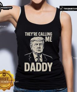 Alt Text: Official Trump 'They're Calling Me Daddy' Tank Top featuring bold text design, perfect for casual summer wear.