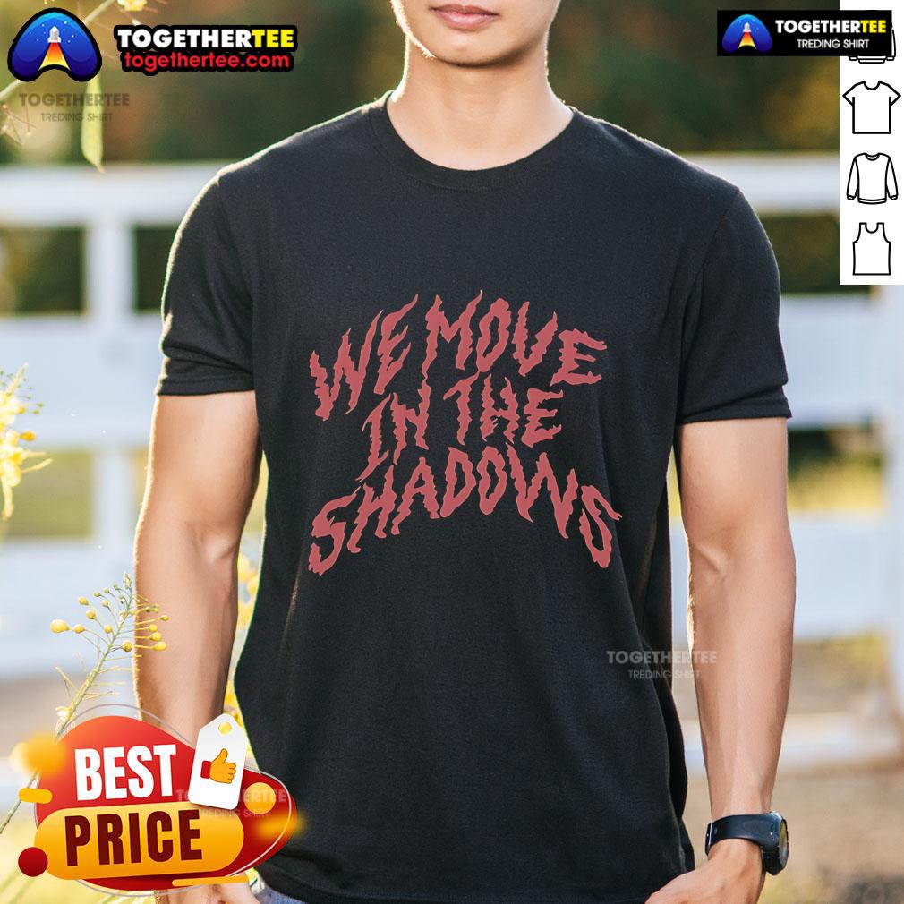 Official We Move In The Shadows T Shirt Alt Text: Official We Move In The Shadows T-Shirt featuring a sleek design and bold graphic, perfect for stealthy style.