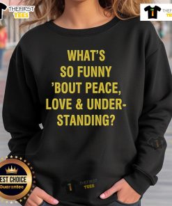 Alt Text: Official What's So Funny 'Bout Peace, Love, and Understanding sweatshirt featuring a stylish design and vibrant colors.