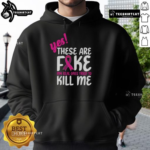 Breast Cancer Awareness hoodie with 'Yes, these are fake. My real one tried to kill me' slogan.