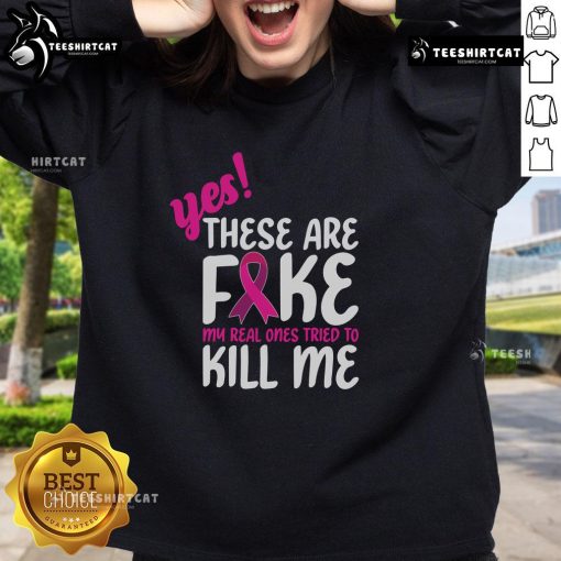 Stylish Breast Cancer Awareness sweatshirt with 'Yes, these are fake' slogan, promoting awareness and support for survivors.