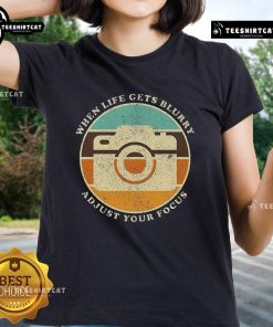 Alt Text: Vintage camera graphic on a ladies' tee with the quote When life gets blurry, adjust your focus.