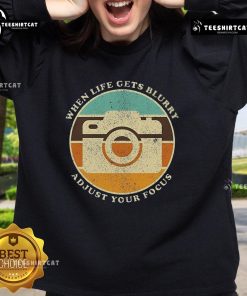 Alt Text: Vintage camera quote sweatshirt featuring When Life Gets Blurry, Adjust Your Focus design for photography lovers.