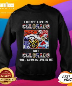Premium sweatshirt featuring 'I Dont Live in Colorado, But Colorado Will Always Live in Me' with sports team graphics.