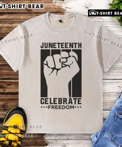 Premium Juneteenth Celebrate Freedom Fist Washed T-Shirt featuring a bold fist graphic, perfect for celebrating freedom.