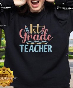 Pretty 1st grade teacher sweatshirt featuring a colorful design, perfect for educators and classroom style.