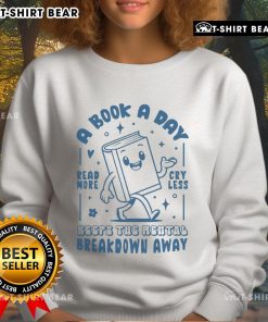 Cozy sweatshirt featuring 'A Book A Day Keeps The Mental Breakdown Away' design, perfect for book lovers and comfort seekers.