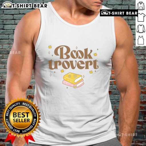Funny book lover wearing a 'Pretty Booktrovert' tank top while reading a book in a cozy setting.