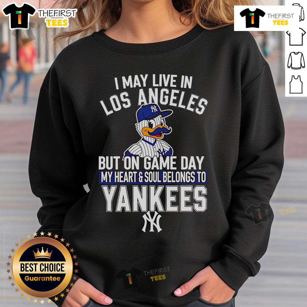 Pretty I May Live In Los Angeles But On Game Day My Heart And Soul Belongs To The New York Yankees Sweatshirt Cozy sweatshirt featuring 'I may live in Los Angeles, but my heart belongs to the New York Yankees' design.
