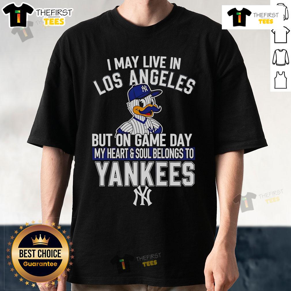 Pretty I May Live In Los Angeles But On Game Day My Heart And Soul Belongs To The New York Yankees T-Shirt Alt Text: New York Yankees T-shirt with 'I May Live In Los Angeles But On Game Day My Heart Belongs To The Yankees' design.