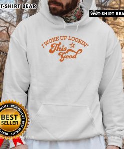 Alt Text: Woman wearing a 'Pretty I Woke Up Lookin This Good' hoodie, showcasing casual style and comfort.