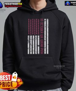 Pretty in October: Women wearing pink hoodies with America flag for Breast Cancer Awareness Month.