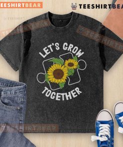 Pretty Let's Grow Together sunflower puzzle piece t-shirt for Autism Awareness, showcasing a colorful design on a washed backdrop.