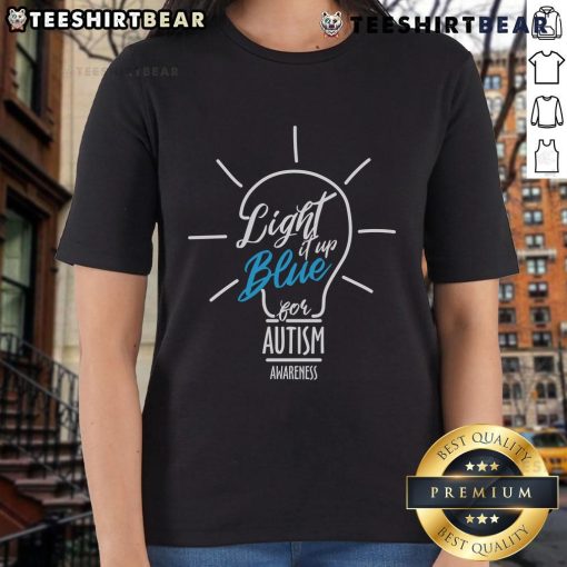 Pretty Light It Up Blue Autism Awareness lightbulb graphic on a stylish ladies tee, promoting autism awareness and support.