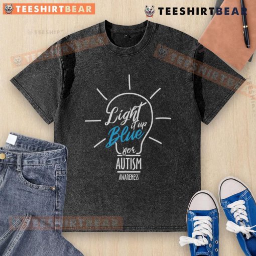 Light It Up Blue Autism Awareness lightbulb graphic on a washed t-shirt, promoting awareness and support for autism.