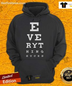 Top 20/20 Vision Everything Sucks Hoodie displayed on a hanger, showcasing its unique design and comfortable fabric.