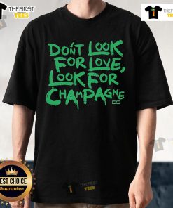 Top Don't Look For Love Look For Champagne T-Shirt design featuring playful text and a trendy style for wine lovers.