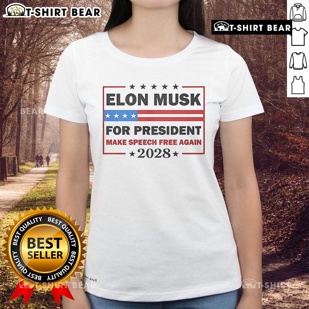 Top Elon Musk For President Make Speech Free Again 2028 Ladies Tee Elon Musk speaking at a rally wearing a 'Make Speech Free Again' tee for his 2028 presidential campaign.