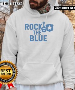 Alt Text: Top guitar and badge on a blue hoodie, showcasing a stylish rock-inspired design perfect for music lovers.