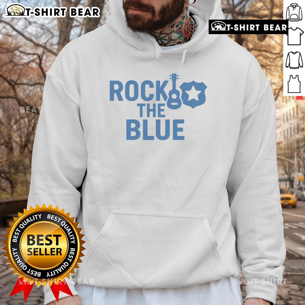 Top Guitar And Badge Rock The Blue Hoodie Alt Text: Top guitar and badge on a blue hoodie, showcasing a stylish rock-inspired design perfect for music lovers.