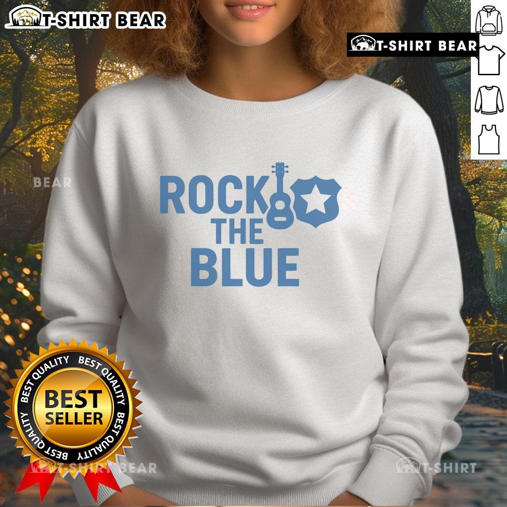 Top Guitar And Badge Rock The Blue Sweatshirt Top guitar and badge graphic on a stylish blue sweatshirt, perfect for music lovers and rock enthusiasts.