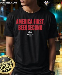 Alt Text: Top Hulk Hogan America First Beer Second T-Shirt featuring a bold graphic design celebrating patriotism and fun.