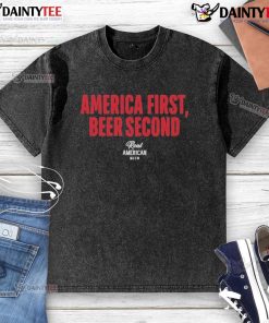 Top Hulk Hogan America First Beer Second washed t-shirt featuring bold graphics and a vintage style design.