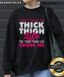 Alt Text: Cozy sweatshirt featuring 'I Didn't Choose The Thick Thigh Life, The Thick Thigh Life Chose Me' design, perfect for curvy fashion.
