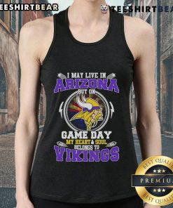 Alt Text: Woman wearing a Minnesota Vikings tank top, showcasing team spirit while living in Arizona on game day.