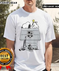 Los Angeles Kings NHL Hockey Snoopy Woodstock House T-Shirt featuring playful graphics and team colors, perfect for fans.