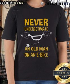 Top Never Underestimate An Old Man On An E-Bike Ladies Tee showcasing a vintage design with a humorous message.