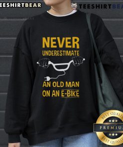 Alt Text: Top Never Underestimate An Old Man On An E-Bike Sweatshirt featuring a vintage design and comfortable fit.