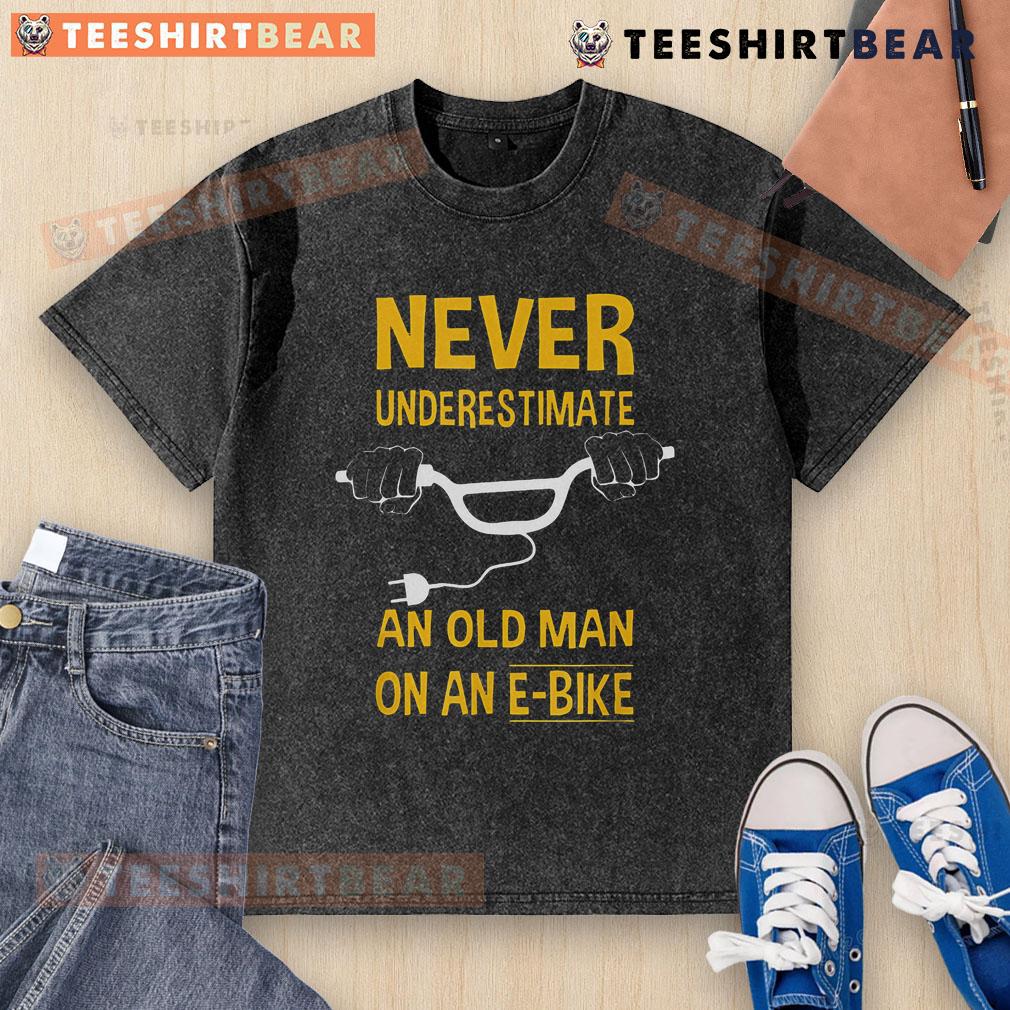 Top Never Underestimate An Old Man On An E Bike Washed T Shirt Top Never Underestimate An Old Man On An E-Bike Washed T-Shirt featuring a bold graphic and comfortable fit.
