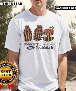 Top Other Side Store Shake It Til' You Make It T-Shirt displayed on a hanger, featuring a stylish design for casual wear.
