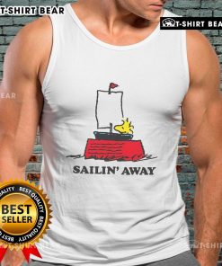 Woman wearing a Top Peanuts Sailin Away tank top, featuring a fun nautical design with iconic Peanuts characters.