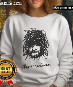 Alt Text: Top Shane MacGowan self-portrait sweatshirt featuring iconic artwork and vibrant colors, perfect for fans.