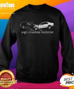 Top sign crushes motorist inside an 'Out Sweatshirt' in a dramatic urban scene highlighting road safety issues.